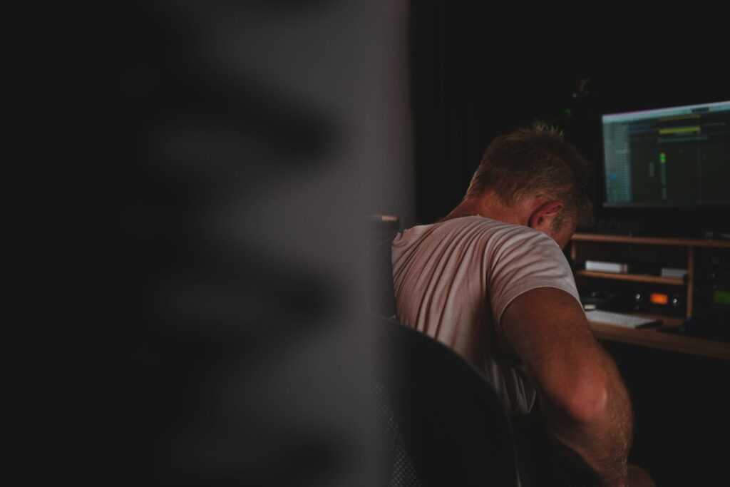 a man sitting in front of a computer